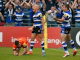 Bath players Peter Stringer and George Ford celebrate after Stringer had scored as Tommy Bell of the Tigers looks on during the Aviva Premiership semi final match between Bath Rugby and Leicester Tigers at Recreation Ground on May 23, 2015