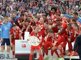 Bayern Munich's players celebrates wining their 25th Bundesliga title after German first division Bundesliga football match FC Bayern Munich vs 1 FSV Mainz 05 at the Allianz Arena in Munich, southern Germany on May 23, 2015