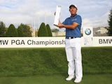 Byeong-Hun An of South Korea holds the trophy following his victory during day 4 of the BMW PGA Championship at Wentworth on May 24, 2015