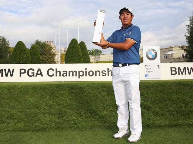 Byeong-Hun An of South Korea holds the trophy following his victory during day 4 of the BMW PGA Championship at Wentworth on May 24, 2015