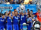 Chelsea's English defender John Terry holds up the trophy during the presentation of the Premier League trophy after the English Premier League football match between Chelsea and Sunderland at Stamford Bridge in London on May 24, 2015