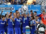 Chelsea's English defender John Terry holds up the trophy during the presentation of the Premier League trophy after the English Premier League football match between Chelsea and Sunderland at Stamford Bridge in London on May 24, 2015