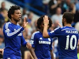 Chelsea's French striker Loic Remy celebrates with Chelsea's Belgian midfielder Eden Hazard (R) after scoring their third goal during the English Premier League football match between Chelsea and Sunderland at Stamford Bridge in London on May 24, 2015