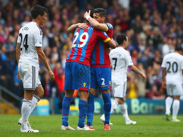 Marouane Chamakh of Crystal Palace celebrates scoring his team's first goal with his team mate Joel Ward during the Barclays Premier League match between Crystal Palace and Swansea City at Selhurst Park on May 24, 2015