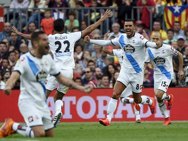 Deportivo's players celebrate a goal during the Spanish league football match FC Barcelona vs RC Deportivo La Coruna at the Camp Nou stadium in Barcelona on May 23, 2015