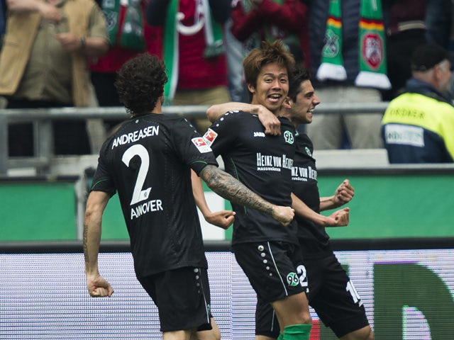Hannover's Japanese midfielder Hiroshi Kiyotake celebrates scoring the opening goal during German first division Bundesliga football match Hannover 96 vs SC Freiburg at the HDI-Arena in Hanover, northern Germany on May 23, 2015