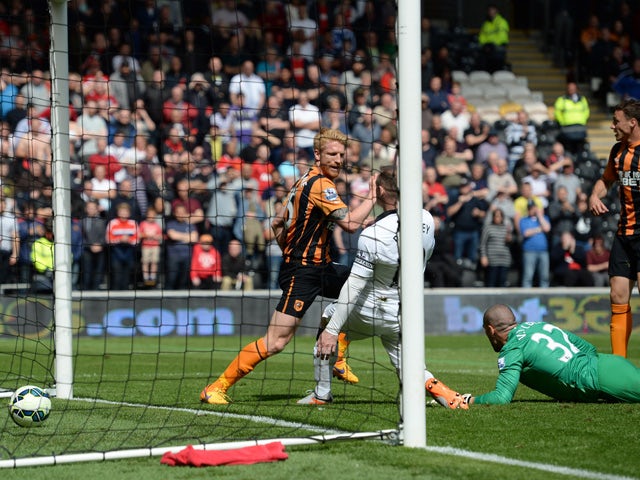 The ball goes into the Manchester United goal past Manchester United's Spanish goalkeeper Víctor Valdes and Manchester United's English striker Wayne Roone but the goal is disallowed for offside during the English Premier League football match between 