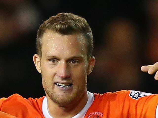 Jeffrey Rentmeister celebrates after victory over Cardiff City in the Sky Bet Championship match between Blackpool and Cardiff City at Bloomfield Road on October 3, 2014