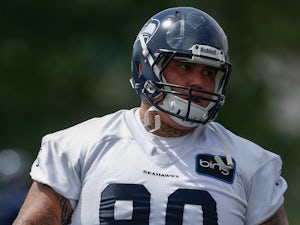 Defensive tackle Jesse Williams #90 of the Seattle Seahawks runs through a drill during Rookie Camp at the Virginia Mason Athletic Center on May 11, 2013