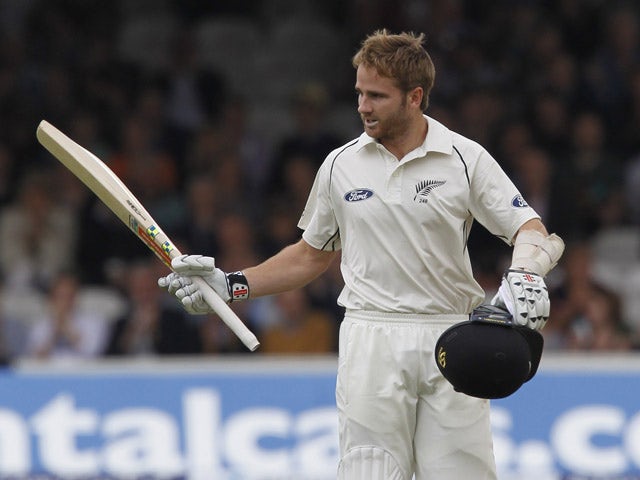 New Zealands Kane Williamson acknowledges the crowd as he reaches his century on the third day of the first cricket Test match between England and New Zealand at Lord's cricket ground in London on May 23, 2015