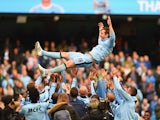 Frank Lampard of Manchester City is thrown into the air by his team mates after the Barclays Premier League match between Manchester City and Southampton at Etihad Stadium on May 24, 2015