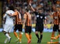Referee Lee Probert shows a red card to Manchester United's Belgian midfielder Marouane Fellaini after a foul on Hull City's Irish defender Paul McShane during the English Premier League football match between Hull City and Manchester United at the KC Sta