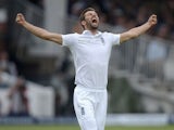 Mark Wood celebrates taking his first Test wicket for England during day three of the First Test against New Zealand on May 23, 2015