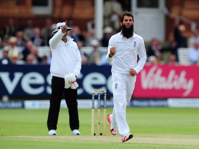 Moeen Ali celebrates taking the wicket of Tom Latham during day two of the First Test between England and New Zealand on May 22, 2015