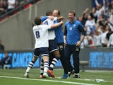 Jermaine Beckford of Preston North End celebrates with manager Simon Grayson after scoring during the League One play-off final between Preston North End and Swindon Town at Wembley Stadium on May 24, 2015 