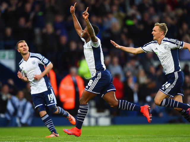 Saido Berahino of West Bromwich Albion (18) celebrates with team mates Callum McManaman (19) and Darren Fletcher (24) as he scores their first goal during the Barclays Premier League match between West Bromwich Albion and Chelsea at The Hawthorns on May 1