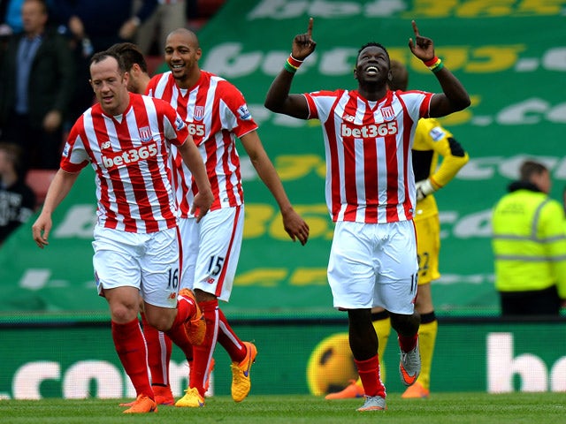 Mame Diouf of Stoke City celebrates scoring their second goal during the Barclays Premier League match between Stoke City and Liverpool at Britannia Stadium on May 24, 2015