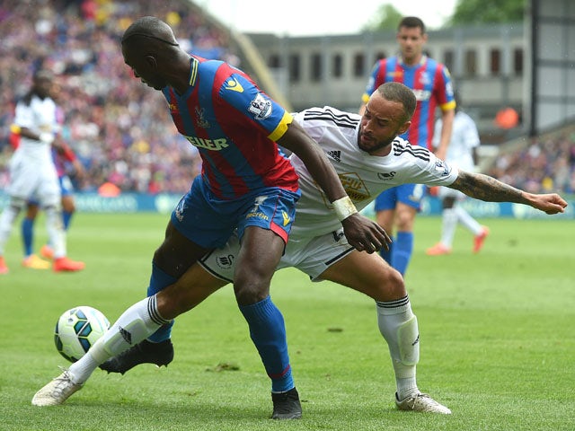 Jazz Richards of Swansea City and Yannick Bolasie of Crystal Palace in action during the Barclays Premier League match between Crystal Palace and Swansea City at Selhurst Park on May 24, 2015