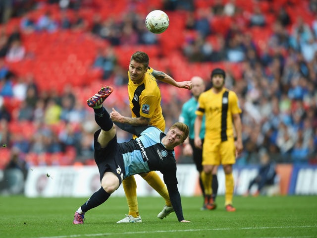 Alfie Mawson of Wycombe in action with Matthew Bloomfield of Southend during the Sky Bet League Two Playoff Final match between Southend United and Wycombe Wanderers at Wembley Stadium on May 23, 2015