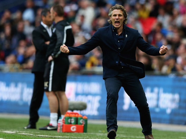 Gareth Ainsworth, manager of Wycombe Wanderers celebrates Joe Jacobson's goal during the Sky Bet League Two Playoff Final between Southend United and Wycombe Wanderers at Wembley Stadium on May 23, 2015