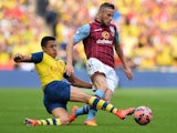 Alexis Sanchez and Tom Cleverley tussle for possession during the FA Cup final at Wembley between Arsenal and Aston Villa on May 30, 2015