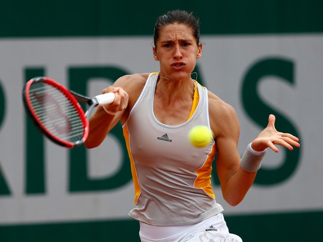 Andrea Petkovic of Germany returns a shot during her women's singles match against Lourdes Dominguez Lino of Spain on day five of the 2015 French Open at Roland Garros on May 28, 2015