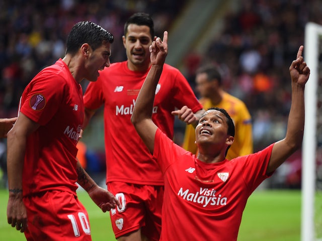 Carlos Bacca of Sevilla celebrates scoring his team's second goal with Jose Antonio Reyes (L) of Sevilla during the UEFA Europa League Final match between FC Dnipro Dnipropetrovsk and FC Sevilla on May 27, 2015 