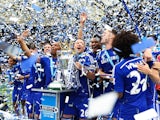 John Terry celebrates with his teammates as Chelsea lift the Premier League trophy on May 24, 2015