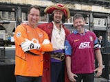 David Seaman and Andy Townsend pose with Captain Morgan himself as a waft of dark rum permeates the brisk morning air on May 30, 2015