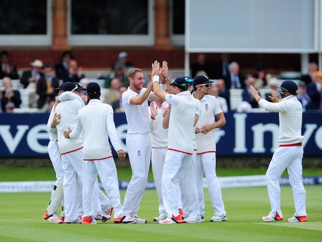An assortment of England teammates celebrate as they take firm control on day five of the First Test with New Zealand on May 25, 2015