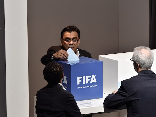 An official casts his vote during the FIFA presidency election on May 29, 2015