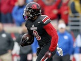 Gerod Holliman #8 of the Louisville Cardinals runs with the ball after intercepting a pass during the game against the Kentucky Wildcats at Papa John's Cardinal Stadium on November 29, 2014