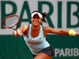 Heather Watson of Great Britain returns a shot during her Women's Singles match against Sloane Stephens of the United States on day five of the 2015 French Open at Roland Garros on May 28, 2015