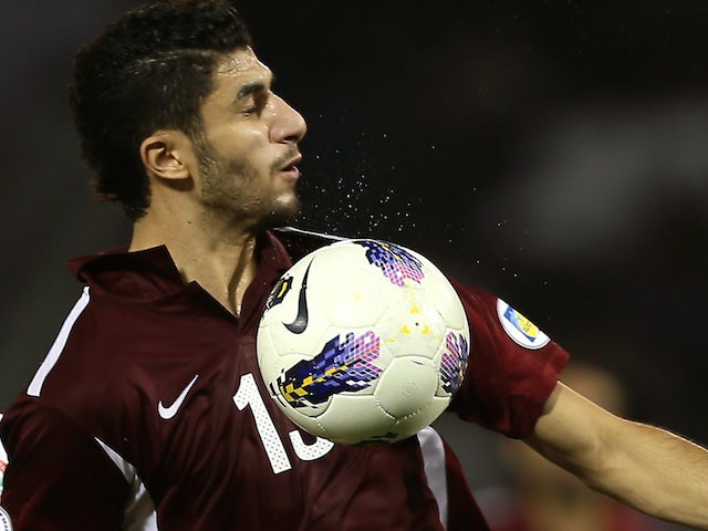 Qatar's Ibrahim Majed (R) challenges Lebanon's Mahmud al-Ali during their 2014 World Cup Asian zone group A qualifying football match in Doha on November 14 , 2012