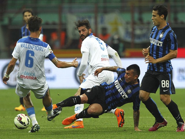 Mirko Valdifior of Empoli FC competes for the ball with Gary Alexis Medel of FC Internazionale Milano during the Serie A match between FC Internazionale Milano and Empoli FC at Stadio Giuseppe Meazza on May 31, 2015
