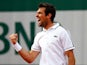 Jeremy Chardy of France celebrates match point in his Men's Singles match against John Isner of the United States on day five of the 2015 French Open at Roland Garros on May 28, 2015
