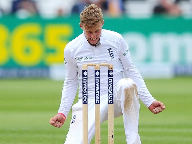 Joe 'Joseph' Root drops to his knees after claiming the wicket of New Zealand's Corey Anderson on May 25, 2015