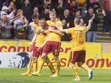 Lionel Ainsworth of Motherwell celebrates his goal making it 2:0 with team mates during the Scottish Premiership play-off final 2nd leg between Motherwell and Rangers at Fir Park on May 31, 2015