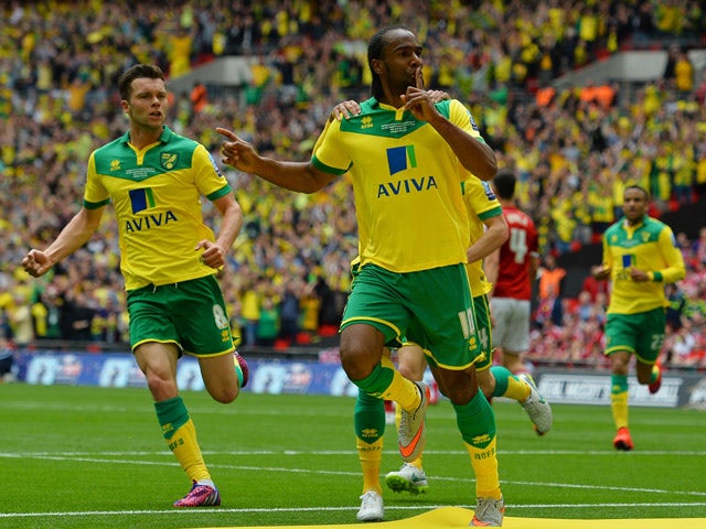 Norwich City's English striker Cameron Jerome celebrates scoring the opening goal during the English Championship play off final football match between Middlesbrough and Norwich City at Wembley Stadium in London on May 25, 2015