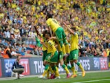 Norwich City players celebrate their second goal scored by Norwich City's English midfielder Nathan Redmond (2L) during the English Championship play off final football match between Middlesbrough and Norwich City at Wembley Stadium in London on May 25, 2