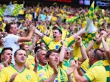 Norwich City fans celebrate during the Sky Bet Championship Playoff Final between Middlesbrough and Norwich City at Wembley Stadium on May 25, 2015