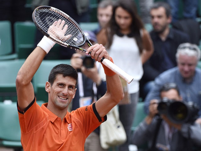 Serbia's Novak Djokovic celebrates after winning his match against Luxemburg's Gilles Muller during the men's second round of the Roland Garros 2015 French Tennis Open in Paris on May 28, 2015