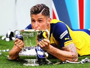 Olivier Giroud of Arsenal kisses the FA Cup at Wembley on May 30, 2015