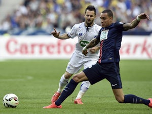 Auxerre's forward Frederic Sammaritano vies with Paris Saint-Germain's Dutch defender Gregory Van der Wiel during the French Cup final football match between Paris Saint-Germain and Auxerre on May 30, 2015 