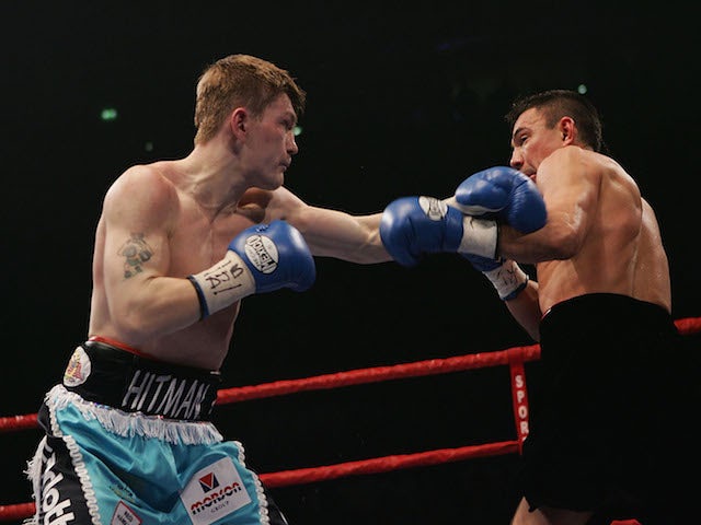 Ricky Hatton (L) in action against Kostya Tszyu during the IBF light welterweight title fight at the MEN Arena on June 4, 2005
