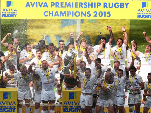 Saracens captain Alistair Hargreaves lifts the Aviva Premiership trophy following his team's 28-16 victory during the Aviva Premiership Final between Bath Rugby and Saracens at Twickenham Stadium on May 30, 2015