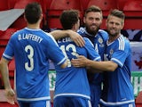 Northern Ireland's Stuart Dallas (2R) is congratulated after scoring during the international friendly football match between Qatar and Northern Ireland at the Alexandra Stadium in Crewe on May 31, 2015