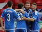 Northern Ireland's Stuart Dallas (2R) is congratulated after scoring during the international friendly football match between Qatar and Northern Ireland at the Alexandra Stadium in Crewe on May 31, 2015