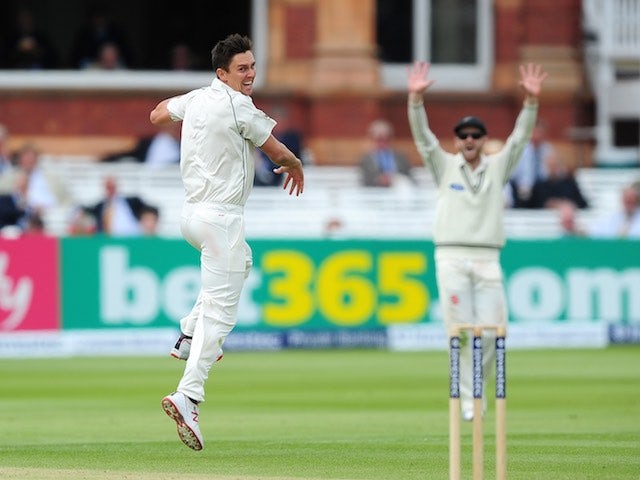 New Zealand's Trent Boult celebrates taking the wicket of England captain Alastair Cook on day five of the First Test on May 25, 2015