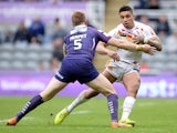 Willie Tonga (R) of Catalans Dragons tackled by Aaron Murphy of Huddersfield Giants during the Super League match between Catalans Dragons and Huddersfield Giants at St James' Park on May 31, 2015